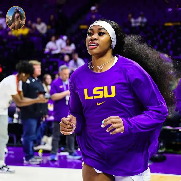 PHOTOS: Social media drools over a photo of LSU superstar Aneesah Morrow posing on the beach in a tiny, thong-cut, cleavage-baring purple bikini, showcasing an unusually alluring physique we’ve never seen before!